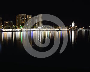 Promenade along the Port, Harbor in Malaga, Spain at Night