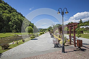 Promenade along a river Szczawnica village on sunny summer day,