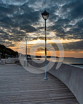Promenade on beach of Baltic sea in Svetlogorsk at sunset. Kaliningrad region. Russia