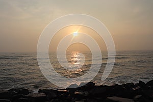 Promenade beach in Puducherry - sunrise - hues in sky - reflection in water - India tourism