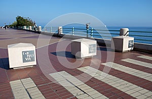 Promenade of Genoa with the mobile bollards showing the city logo, Italy
