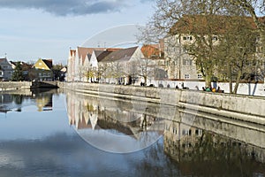 Promenade and historic buildings in Landsberg at Lech river