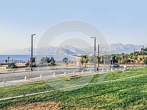 Promenade of Konyaalti Plaji overlooking the mountains and the beach in Antalya