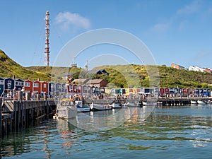 Promenade with lobster shacks at harbour of Helgoland island in North Sea, Germany