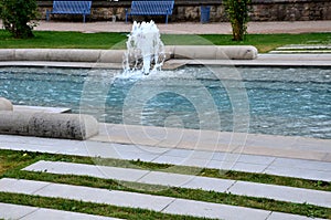 promenade in the park, artificial stream in the gutter.