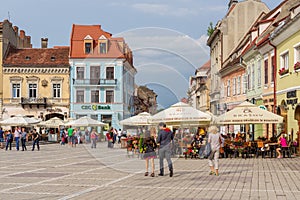 Promenade on Sfatului Place at Brasov, in Romania.