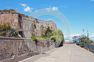 Promenade under walls of ancient fortress. Savona, Italy