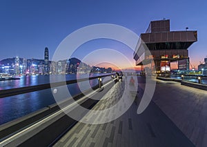 Promenade of Victoria harbor of Hong Kong city at dusk