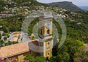 Prominent ochre colored church and clocktower, Eze Village, France.