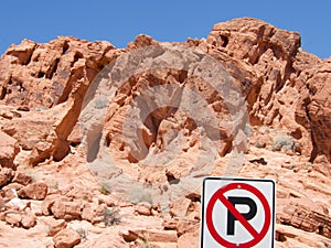 Prominent "No Parking" sign displayed amidst the rocky terrain photo