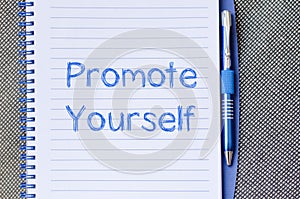 Promote yourself write on notebook