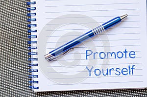 Promote yourself write on notebook