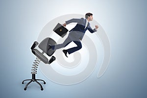 Promotion concept with businessman ejected from chair