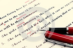 Proofreading of English sentences on white paperwork