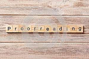 Proofreading word written on wood block. proofreading text on table, concept