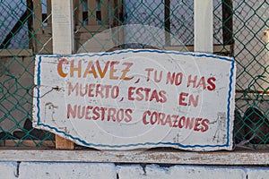 Propaganda near Baracoa, Cuba. It says: Chavez, you did not die, you are staying in ou heart photo