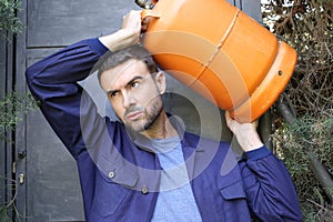 Propane tank delivery man with attractive look photo