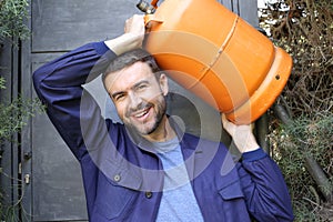 Propane tank delivery man with attractive look photo