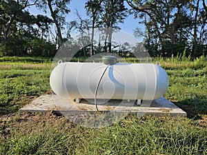 Propane tank on rural acreage.