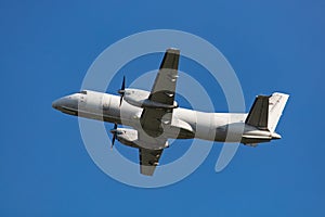 Propeller airplane in blue sky