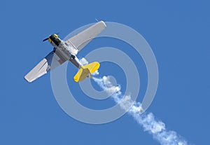 Propeller airplane with smoke