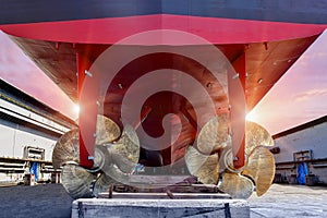 Propeller Close up and Repair Cargo ship in floating dry dock.