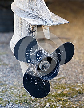 A propeller is covered in dirt and grime photo