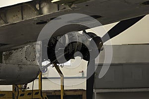 propeller of a dismantled old plane inside a hangar