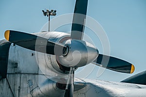 Propeller and engine of big old retro cargo airplane, close up