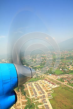 Propeller of old airplane with view of beautiful white cloud