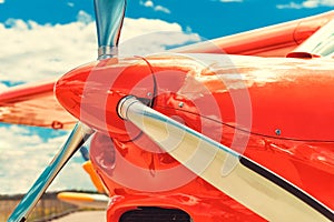 Propeller of a red airplane at the airport