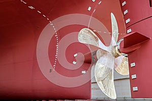 Propeller rudder big at stern ship under maintenance.