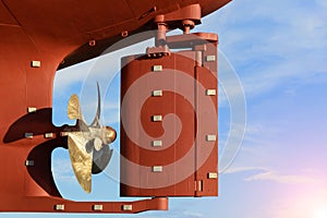 Propeller and rudder of Large cargo ships, aft of the commercial ocean ship in floating dry dock yard.