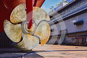 Propeller with rudder in shipyard for maintenance.