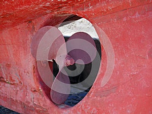 Propellor on an old red wooden fishing boat