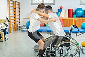 Proper lifting technique from a wheelchair photo