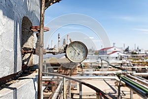 Properly working pressure gauge installed on the pipeline at the old chemical plant