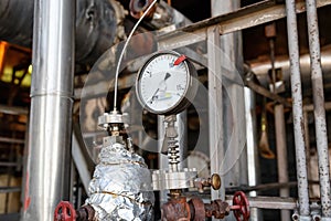 Properly working pressure gauge installed on the pipeline at the old chemical plant
