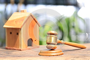 Property auction, Gavel wooden and model house on natural green background, lawyer of home real estate and ownership property