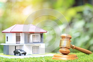 Property auction, Gavel wooden and model house on natural green background, lawyer of home real estate and ownership property