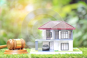 Property auction, Gavel wooden and model house on natural green background, lawyer of home real estate and ownership property