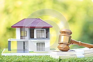 Property auction, Gavel wooden and model house on natural green background, lawyer of home real estate and ownership property