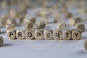 Property - cube with letters, sign with wooden cubes