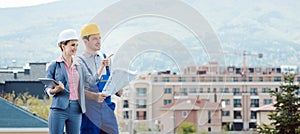 Property developer and construction worker creating project together