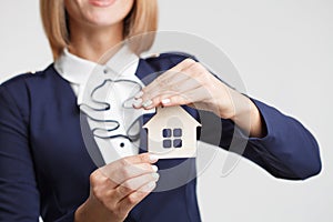 Property insurance and security concept.Real estate agent offer house