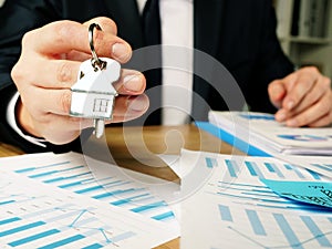 Property investment. Realtor offers real estate key