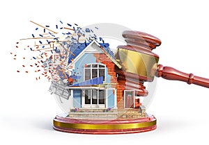 Property litigation. Judge`s gavel breaks part of the house.