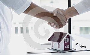 Property manager Shake hands with congratulations on the customers who bought the house with insurance, Hand shake