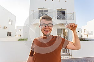 Property, ownership, new home and people concept - Young man moving into new home