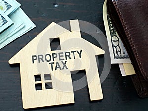 Property tax sign on a house model